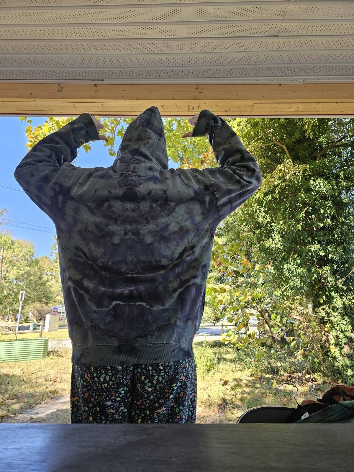 Customer wearing a SnowyBones tie-dye hoodie